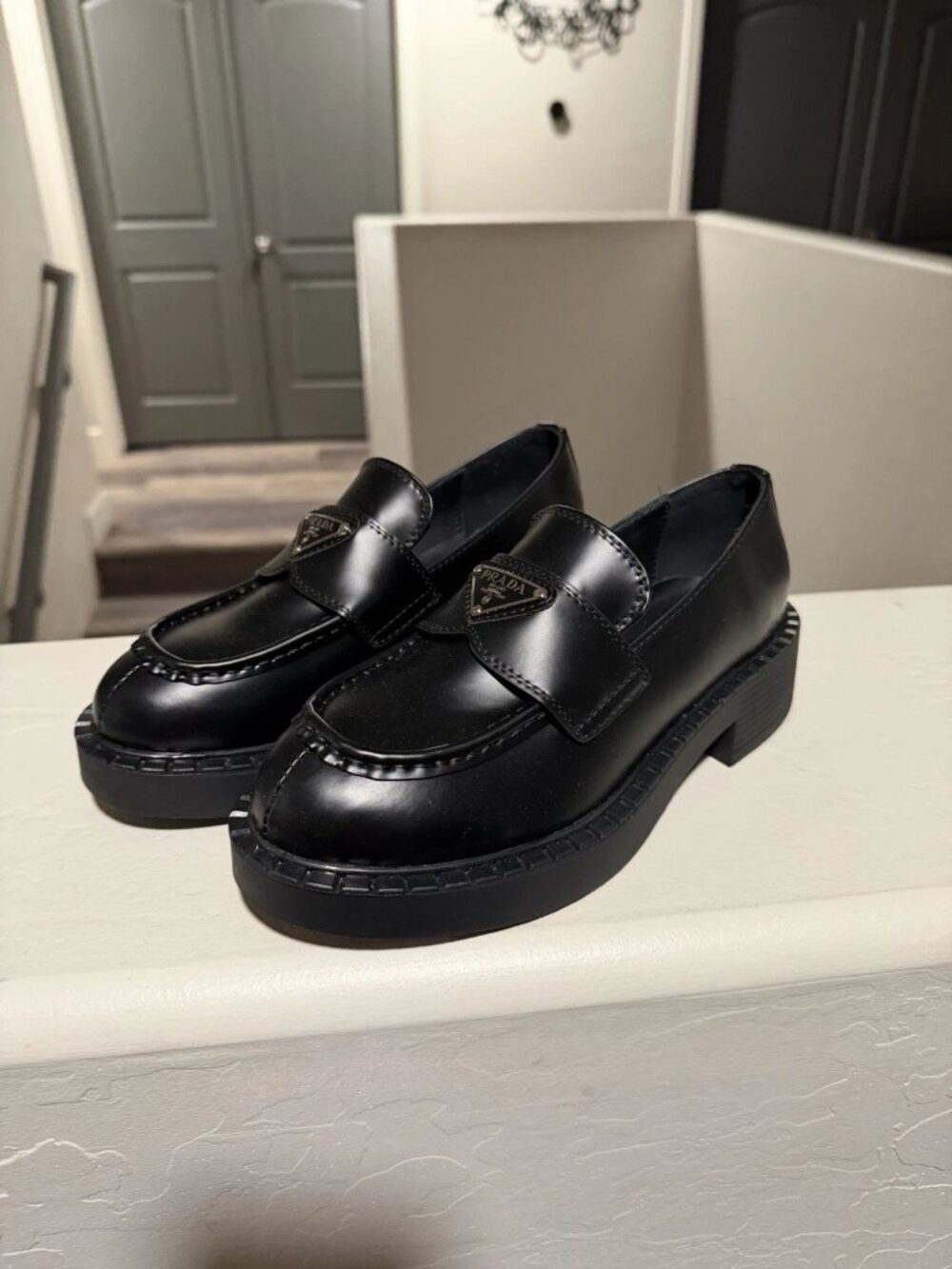 Prada Spazzolato Metal Triangle Logo Loafers Black Loafers